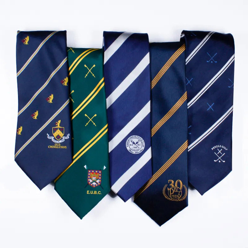 A collection of ties featuring various designs, including a school tie with a batch from K Square Edutainment.