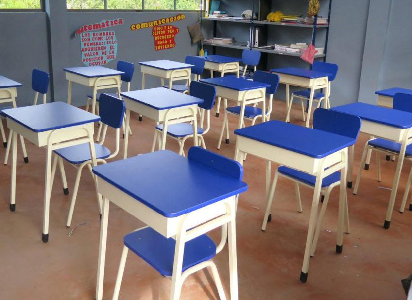 A classroom filled with individual K square edutainment blue chairs and table