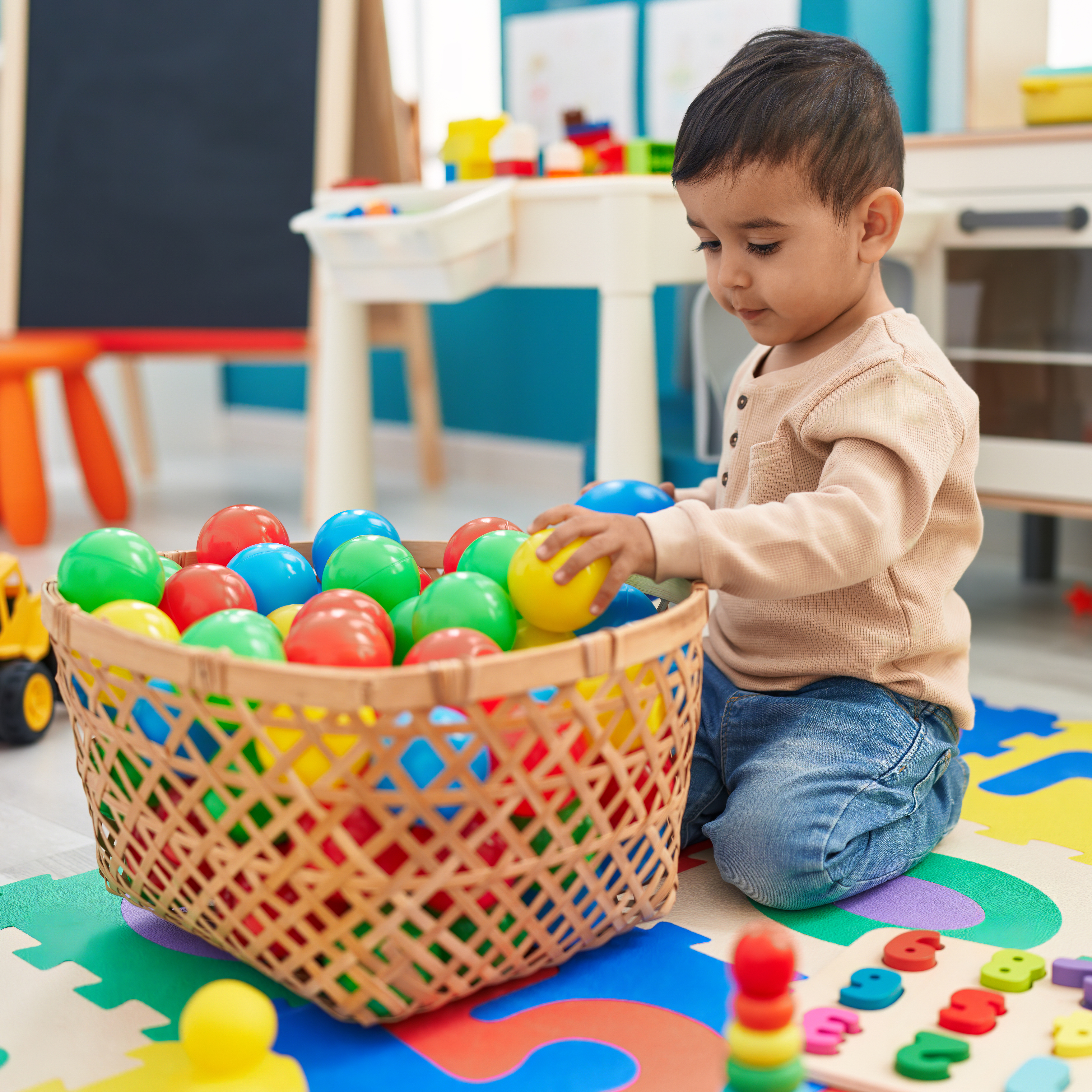 A woman and child playing with K square edutainment toys together